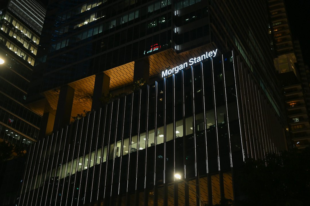 Morgan Stanley building illuminated at night, photographed by yanzheng xia on Unsplash